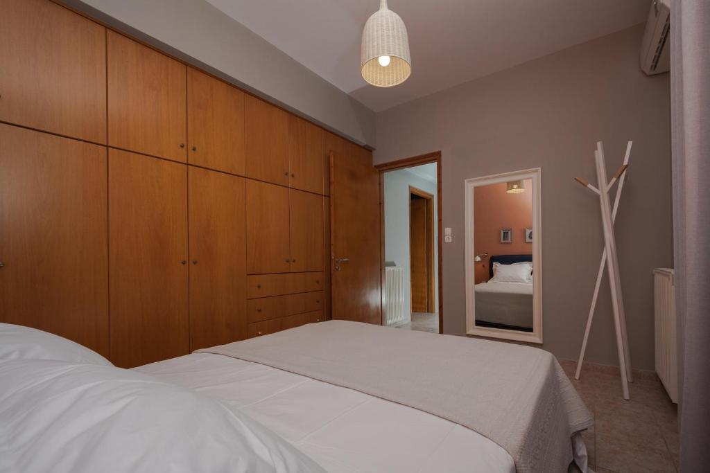 A bed or beds in a room at Live in Lemnos Apartments