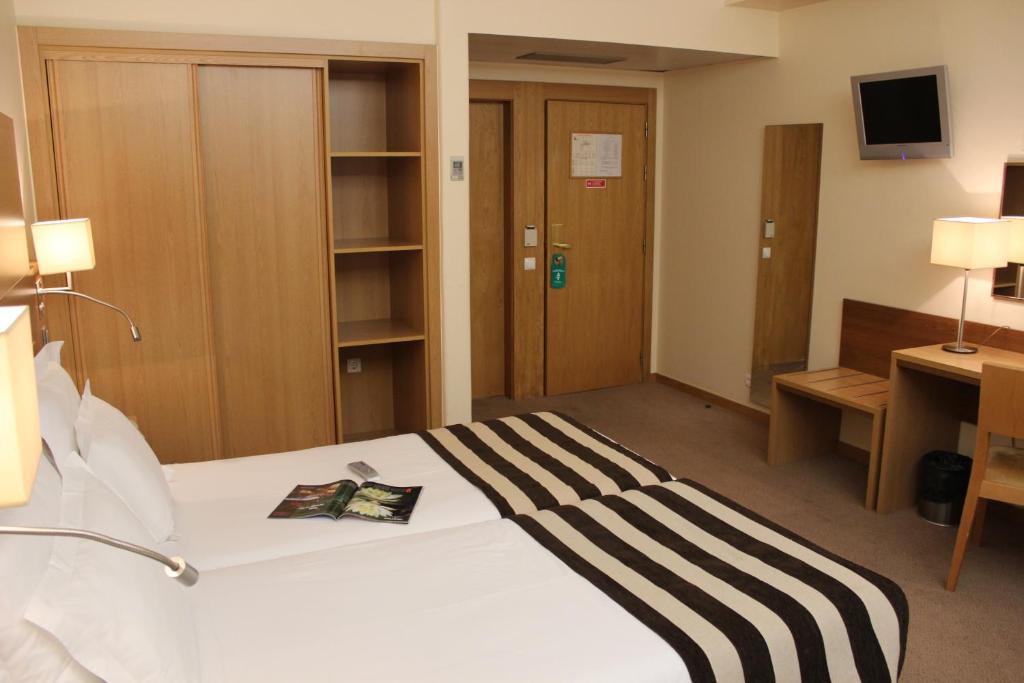 Postel nebo postele na pokoji v ubytování Hotel Principe Lisboa