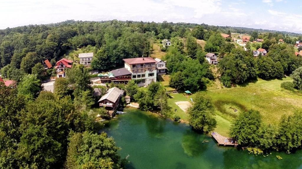 an aerial view of a house next to a river at Bed & Breakfast Zeleni Kut in Gornji Zvečaj
