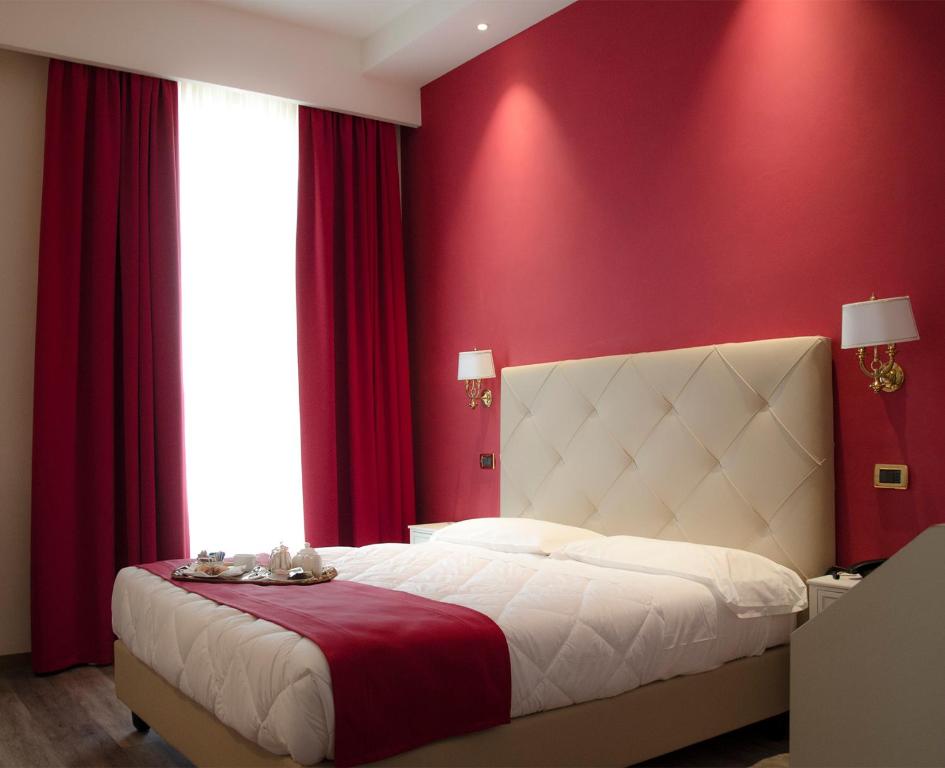 Postel nebo postele na pokoji v ubytování Hotel Settentrionale Esplanade