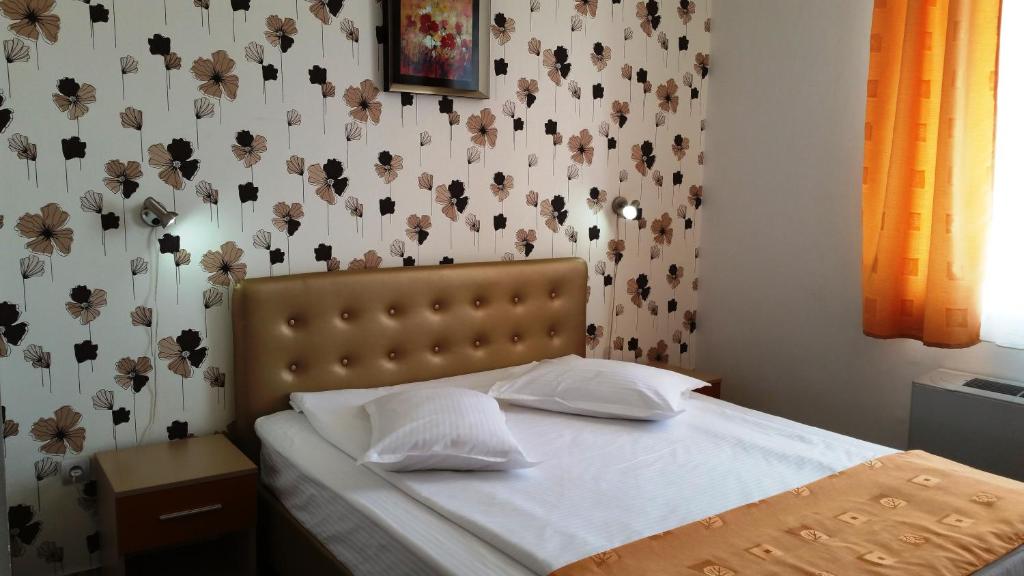 Postel nebo postele na pokoji v ubytování Hotel Ovidiu