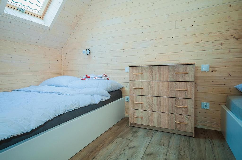 Postel nebo postele na pokoji v ubytování Sloneczne Sarbinowo