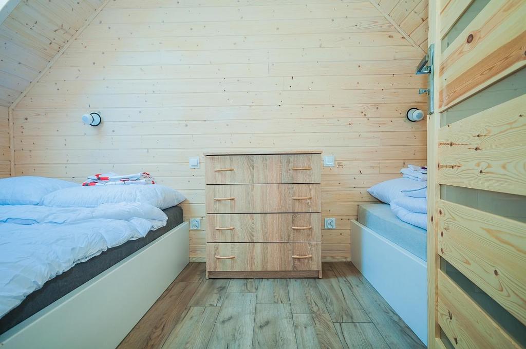 Postel nebo postele na pokoji v ubytování Sloneczne Sarbinowo