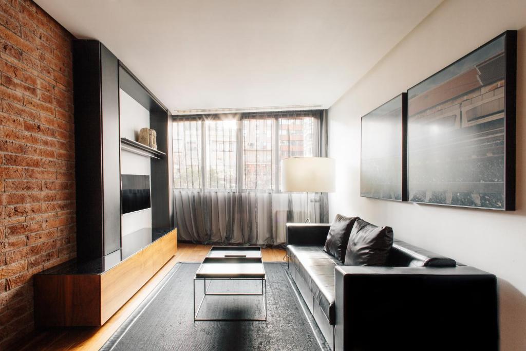 TV a/nebo společenská místnost v ubytování Suites Avenue
