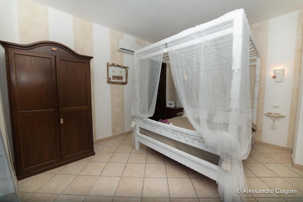 Postel nebo postele na pokoji v ubytování Li Espi Country Resort