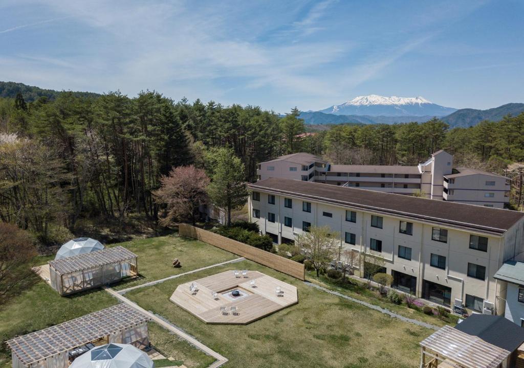 an aerial view of a building and a mountain at Morino Hotel in Kiso