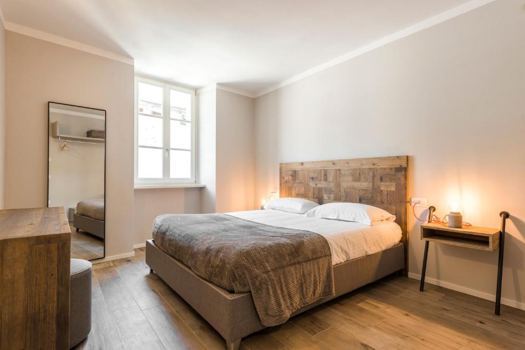 Łóżko lub łóżka w pokoju w obiekcie Casa Tonetta Luxury Apartments