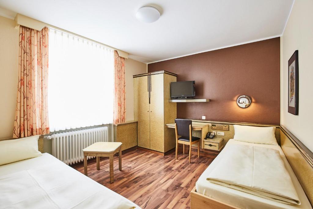 Postel nebo postele na pokoji v ubytování Hotel Imperial