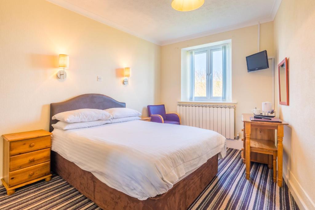 Postel nebo postele na pokoji v ubytování Marton Guest House