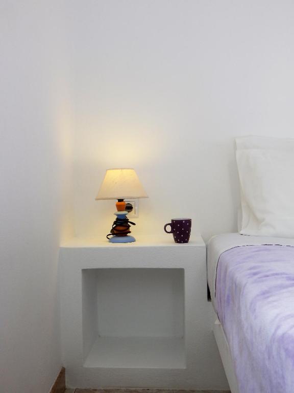 Łóżko lub łóżka w pokoju w obiekcie Evgenia Rooms and Apartments