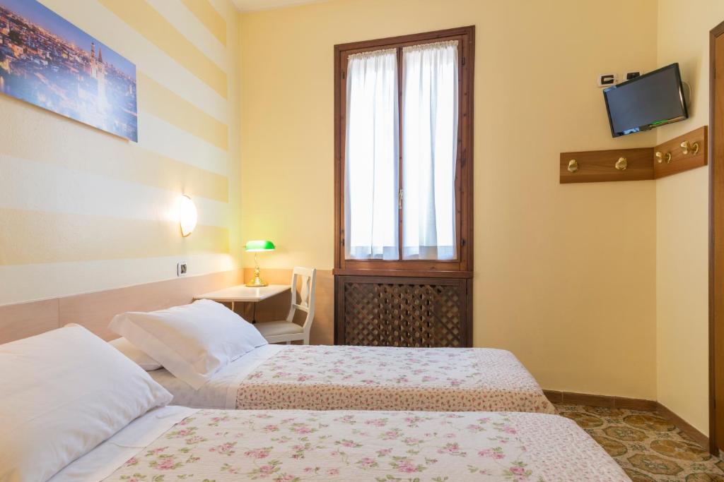 Postel nebo postele na pokoji v ubytování Albergo Trento