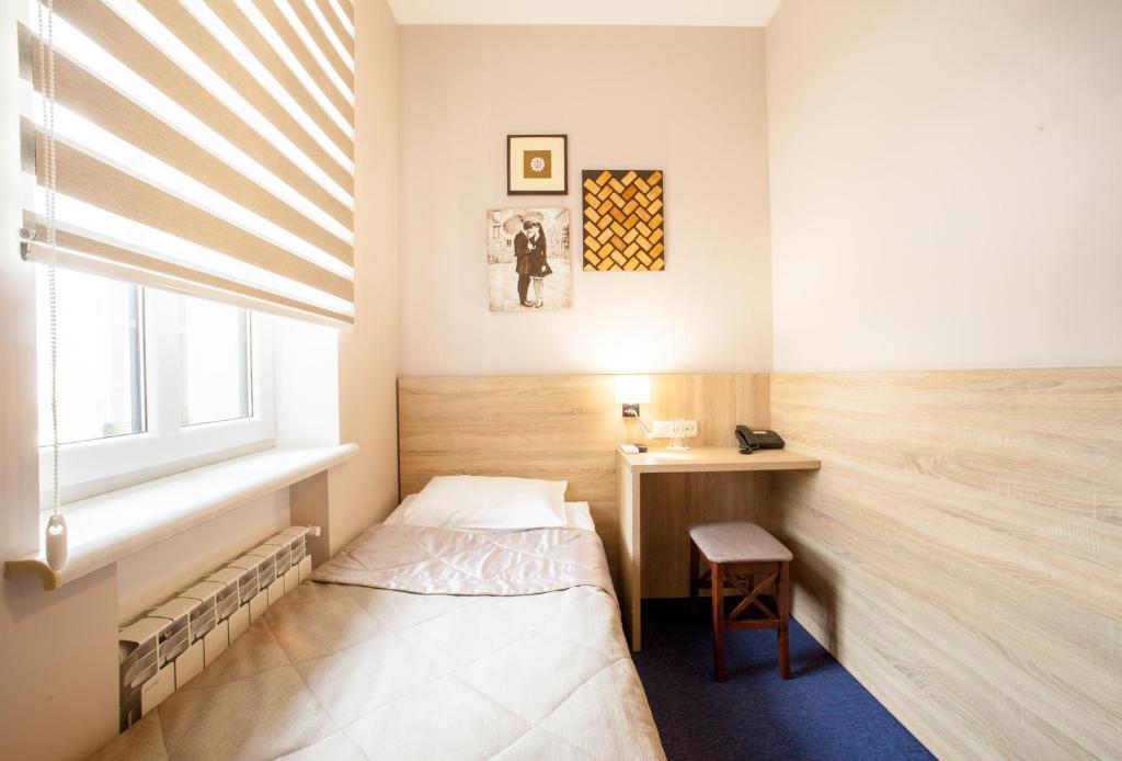 Postel nebo postele na pokoji v ubytování Mackintosh Hotel