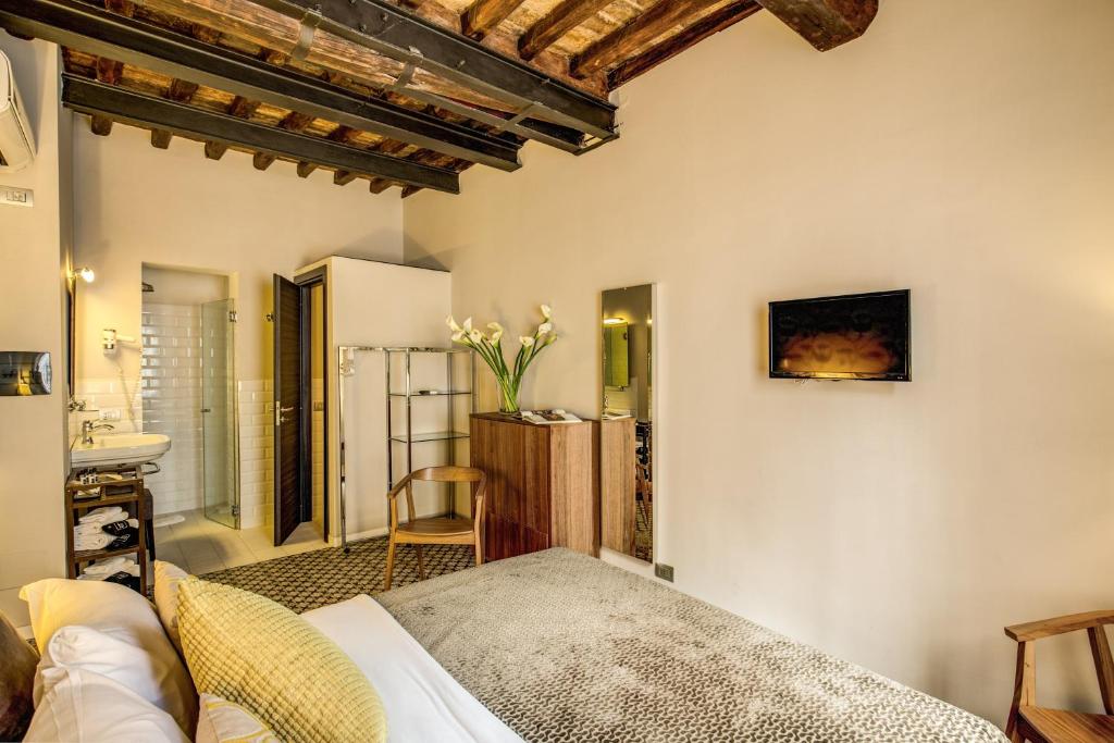 Postel nebo postele na pokoji v ubytování Trevi Beau Boutique Hotel