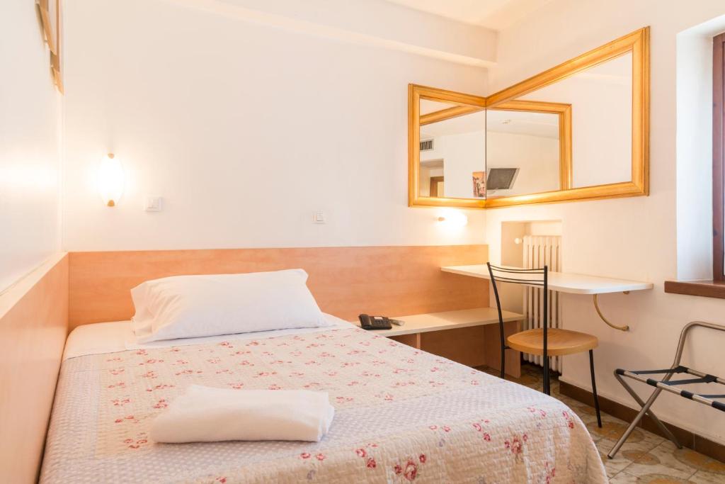Postel nebo postele na pokoji v ubytování Albergo Trento