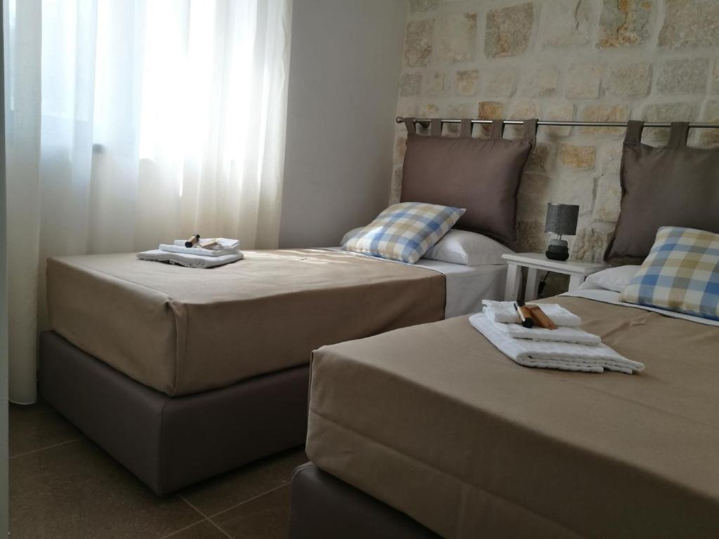 Postel nebo postele na pokoji v ubytování Hotel Residence La Corvetta