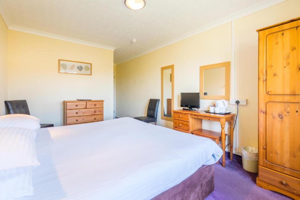 Postel nebo postele na pokoji v ubytování Marton Guest House