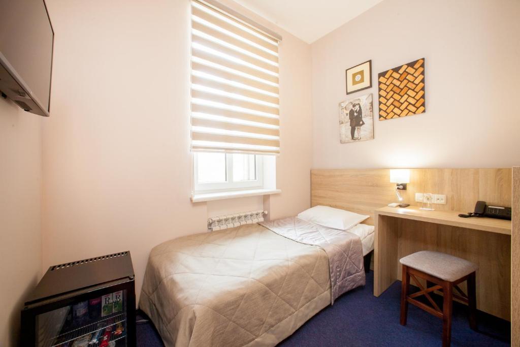 Postel nebo postele na pokoji v ubytování Mackintosh Hotel