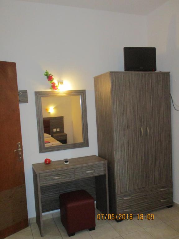 Telewizja i/lub zestaw kina domowego w obiekcie Gouvia House Luxury Apartments