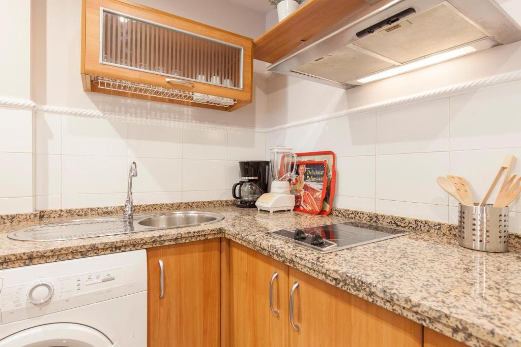 Kuchnia lub aneks kuchenny w obiekcie Elegante apartamento en el corazon de Sevilla.