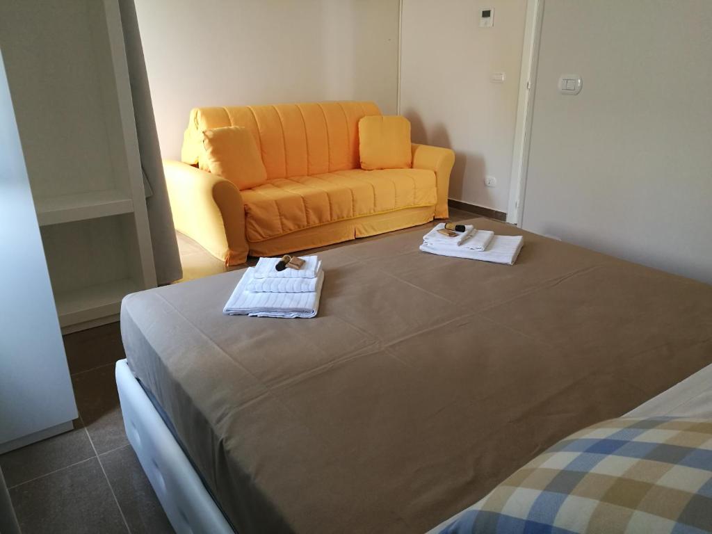 Postel nebo postele na pokoji v ubytování Hotel Residence La Corvetta
