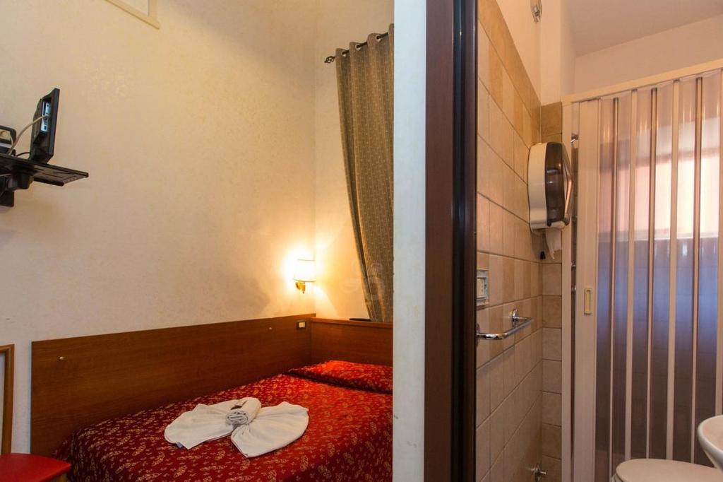 Postel nebo postele na pokoji v ubytování Hotel Il Papavero