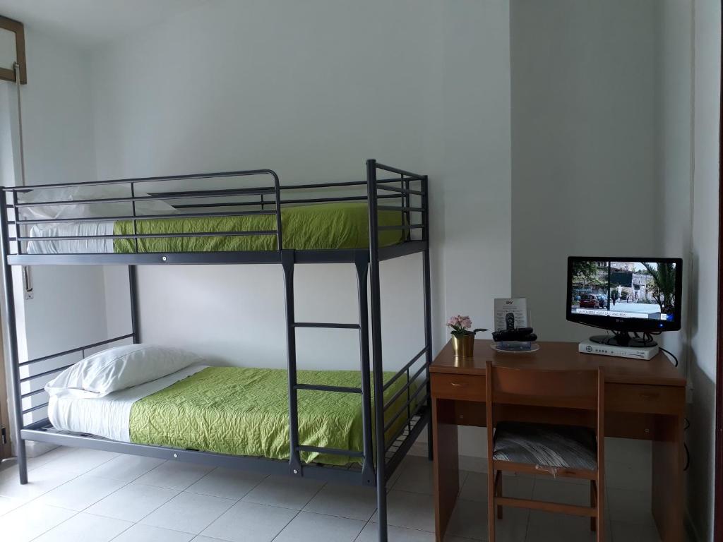 Postel nebo postele na pokoji v ubytování Pensione Nettuno