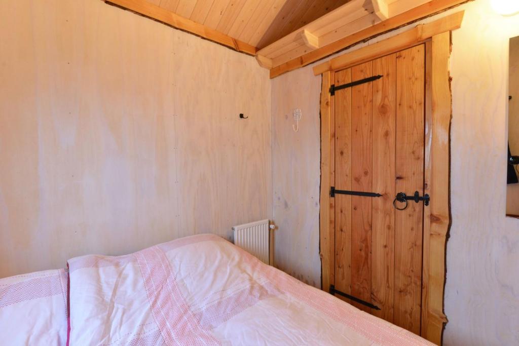 Postel nebo postele na pokoji v ubytování Camping De Koeksebelt