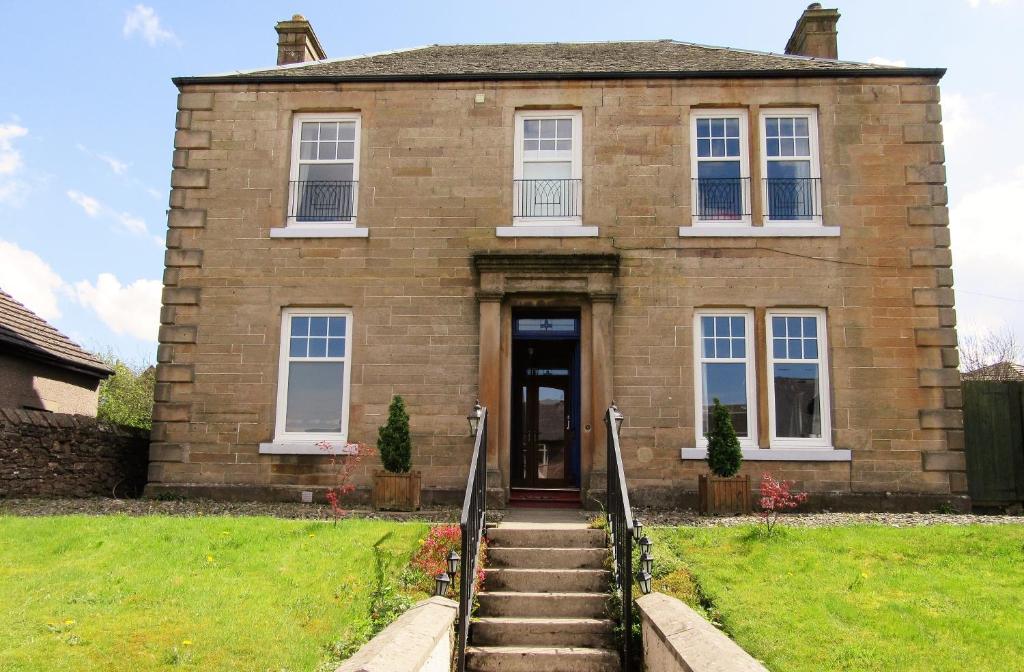 a brick house with stairs leading to the front door at Middleton House Bed and Breakfast in Auchterarder