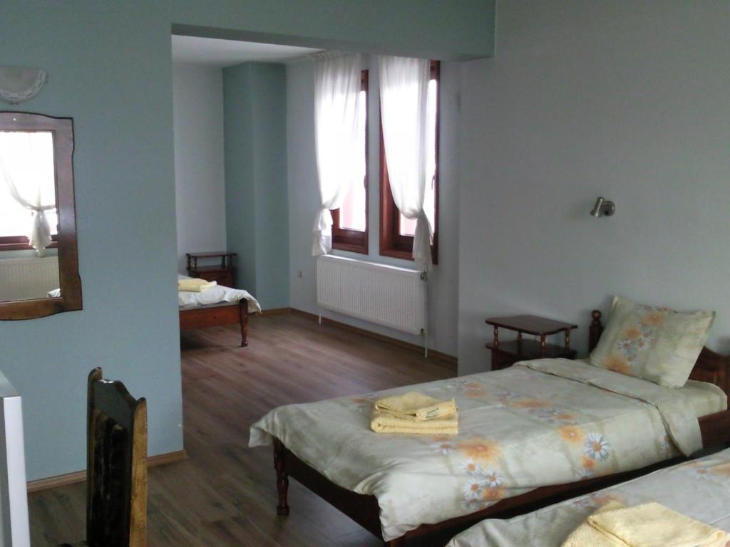 Postel nebo postele na pokoji v ubytování Guest House Ilinden