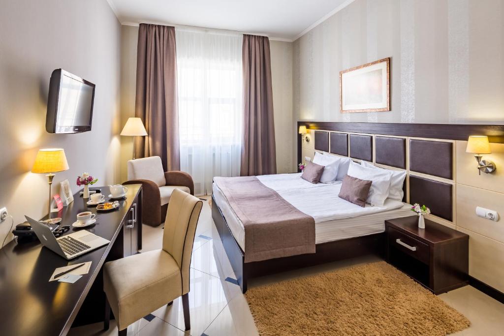 Ліжко або ліжка в номері Taurus Hotel & SPA