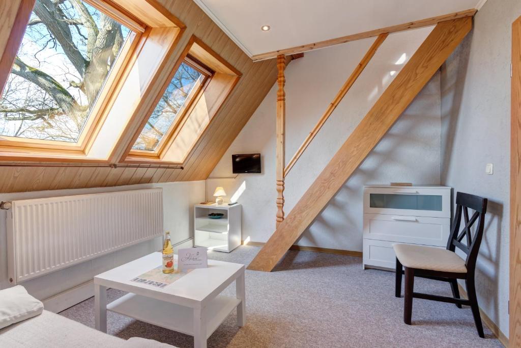 a living room with an attic with skylights at Ferienwohnung Grams in Lassan
