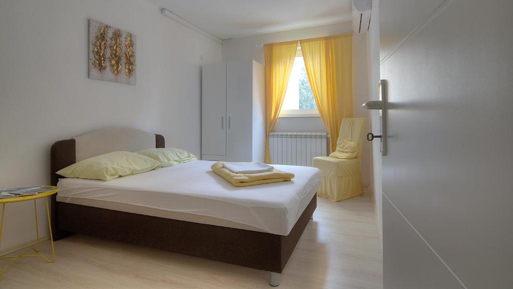 Postel nebo postele na pokoji v ubytování Apartments & Rooms Josephine