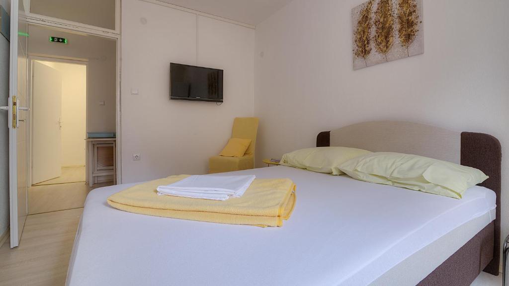 Postel nebo postele na pokoji v ubytování Apartments & Rooms Josephine