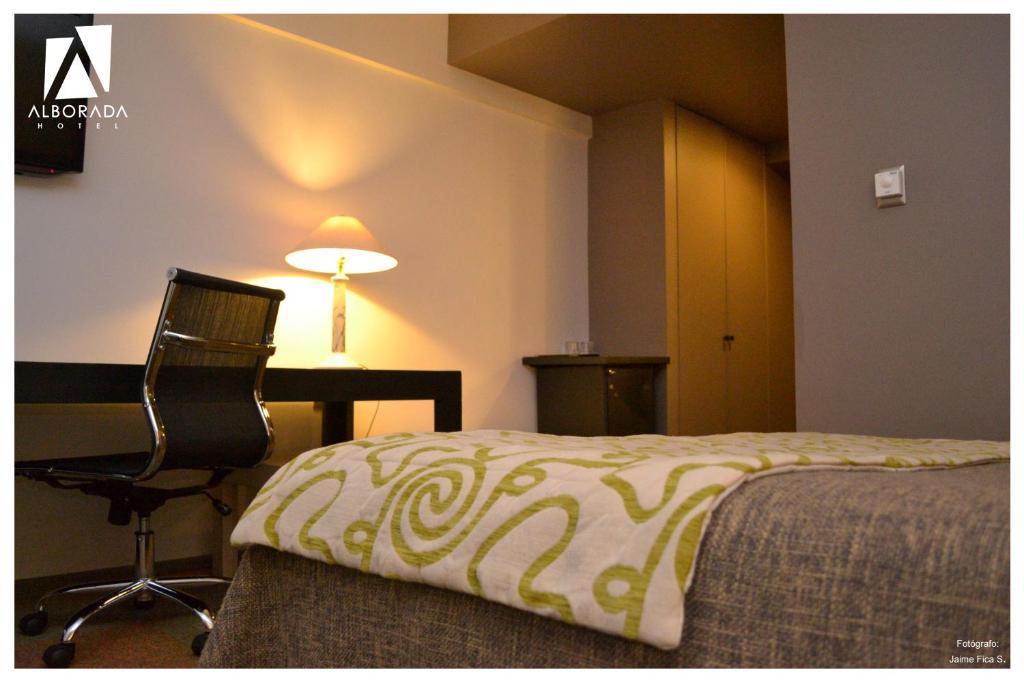 Postel nebo postele na pokoji v ubytování Hotel Alborada