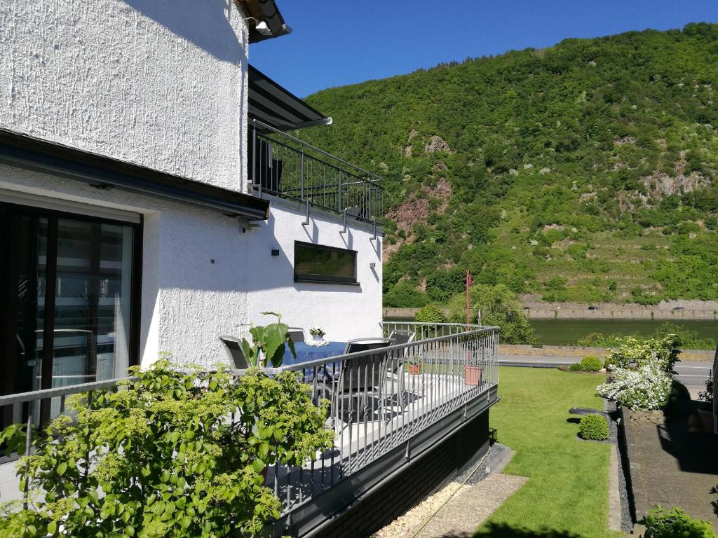 a balcony of a house with a mountain in the background at Haus Korjässer in Löf