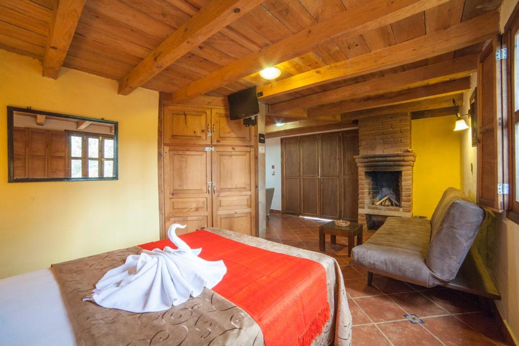 Postel nebo postele na pokoji v ubytování Cabañas Suites Sergia Torres