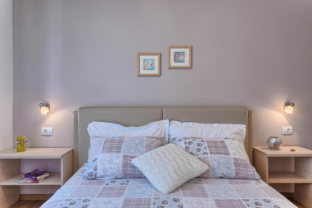 Postel nebo postele na pokoji v ubytování Apartments Vlasta