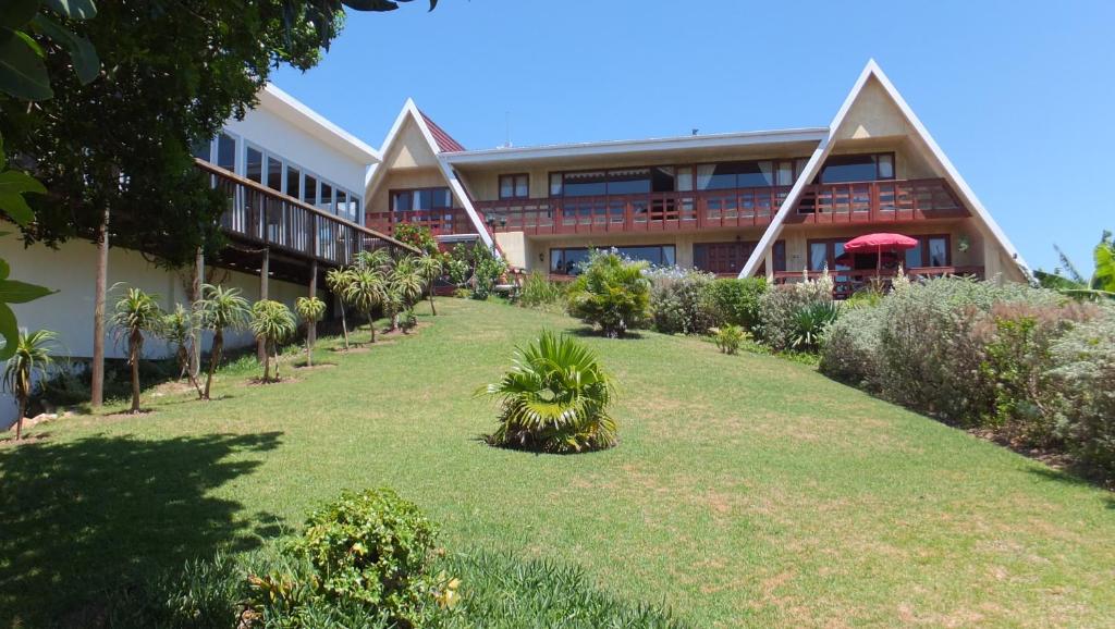 a building with a lawn in front of it at Heidi Haus in Port Alfred