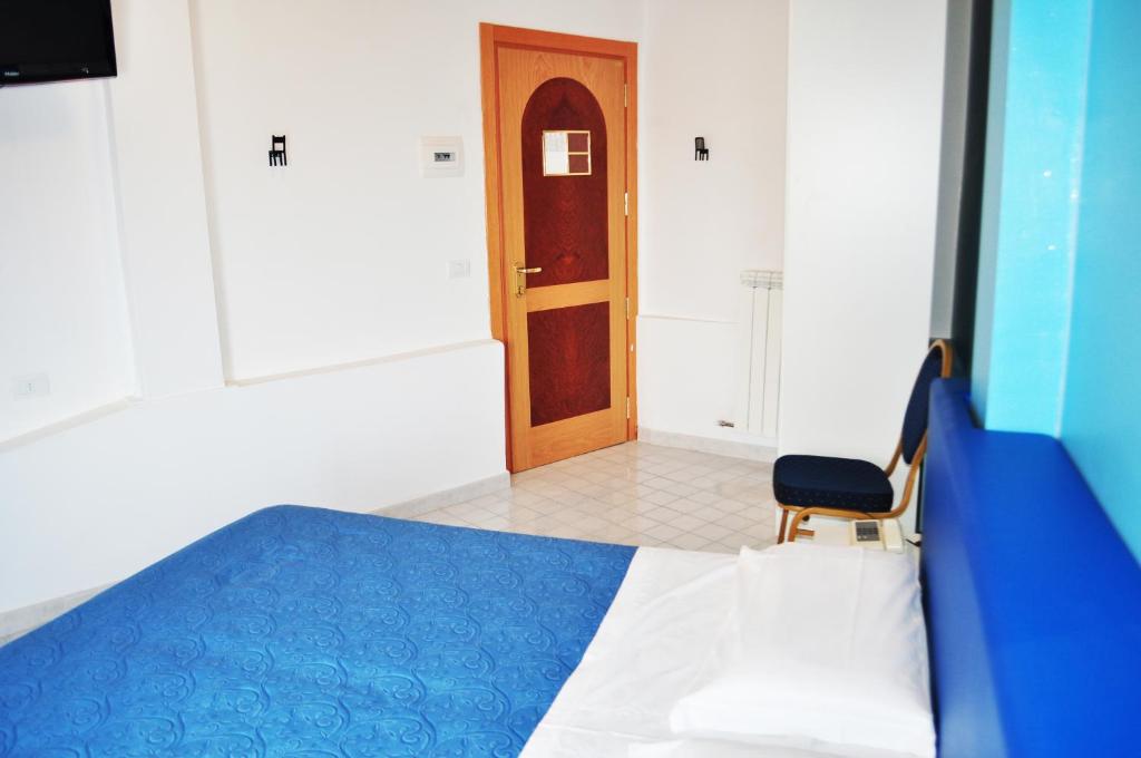 Postel nebo postele na pokoji v ubytování Hotel Albatros
