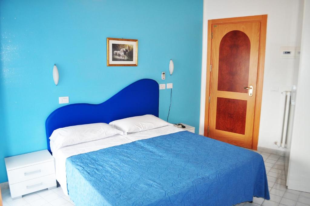 Postel nebo postele na pokoji v ubytování Hotel Albatros