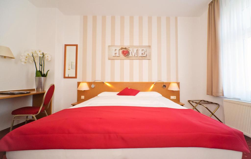 Postel nebo postele na pokoji v ubytování City-Hotel Am Wasserturm Halle
