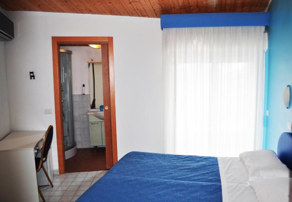 Postel nebo postele na pokoji v ubytování Hotel Albatros