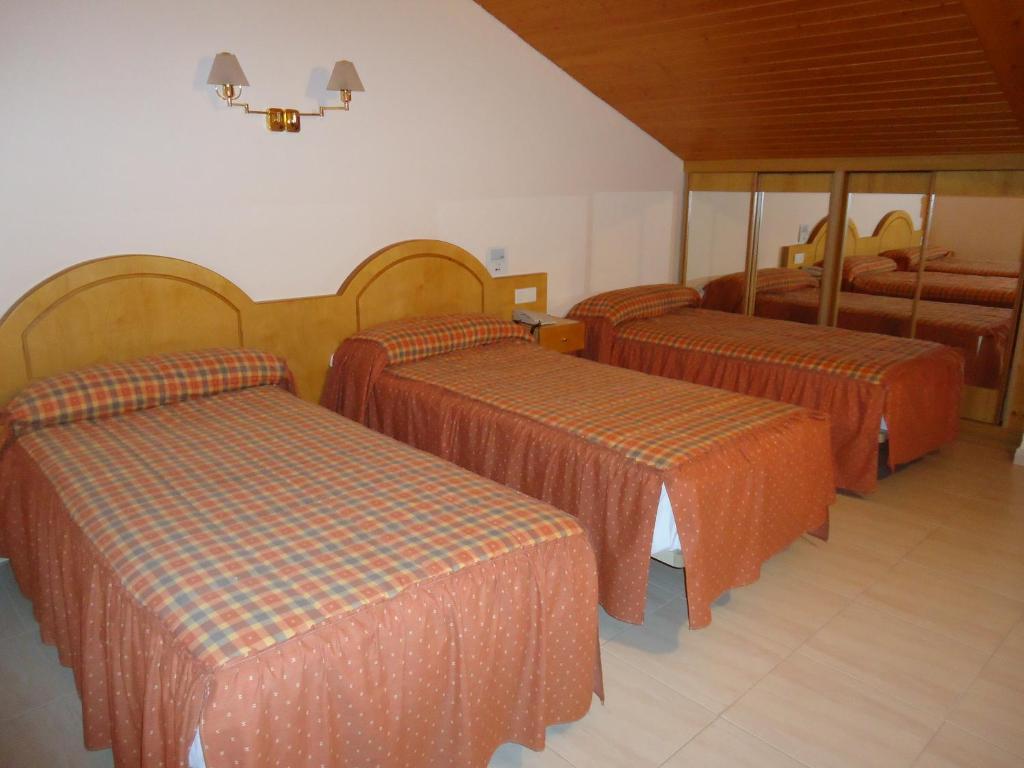Postel nebo postele na pokoji v ubytování Hotel Silos 2000