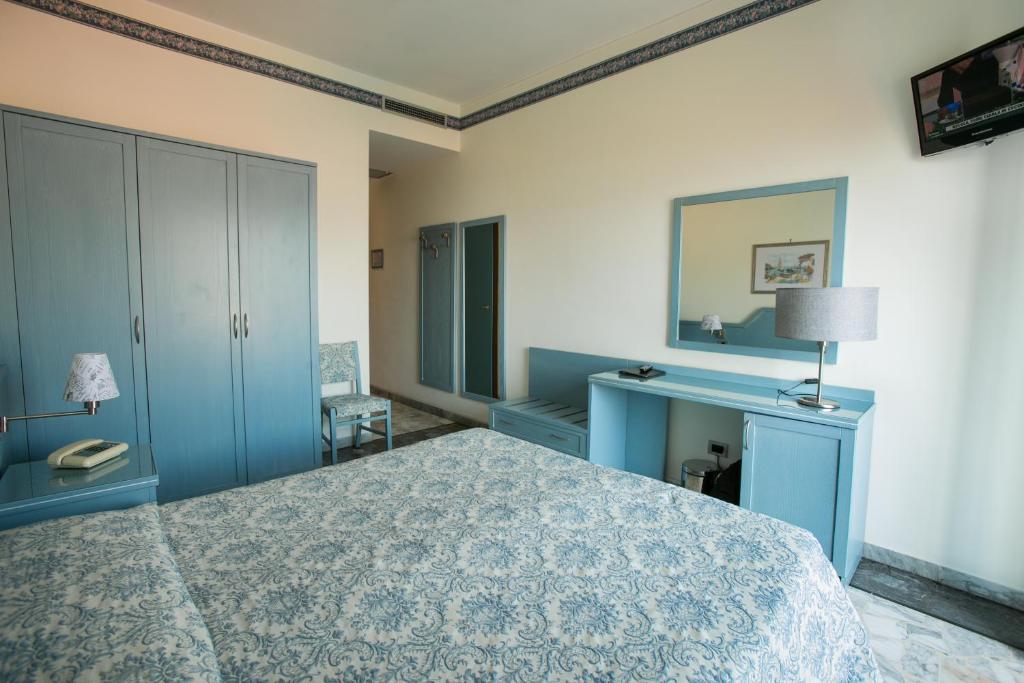 Postel nebo postele na pokoji v ubytování Hotel Ariston