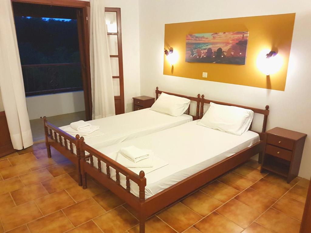 A bed or beds in a room at Alexandros Studios