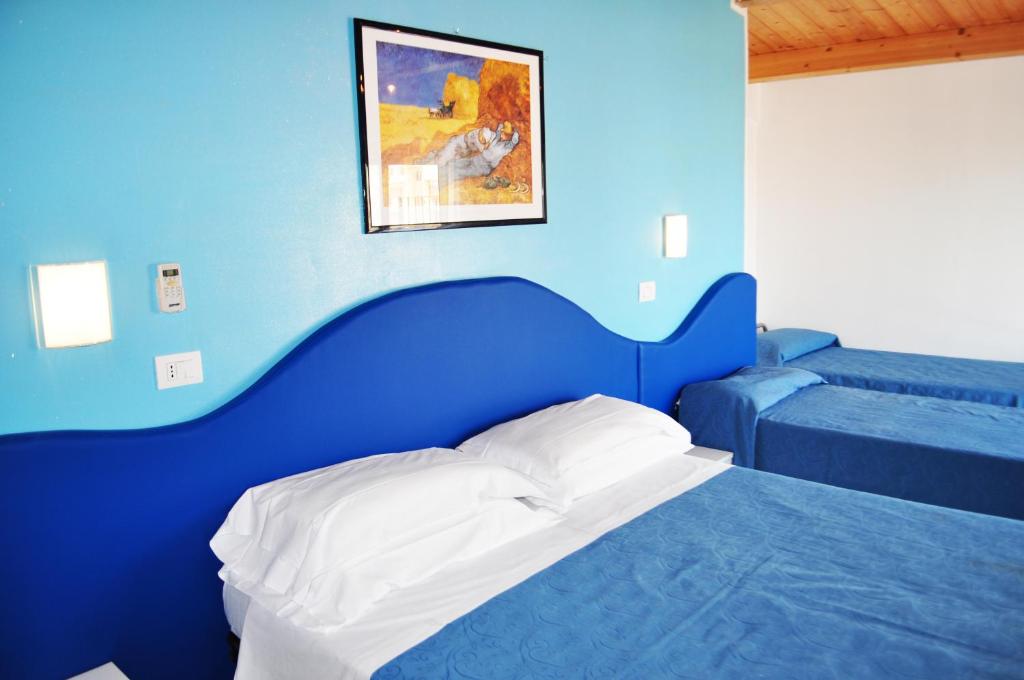 Postel nebo postele na pokoji v ubytování Hotel Albatros