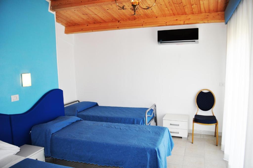 Postel nebo postele na pokoji v ubytování Hotel Albatros