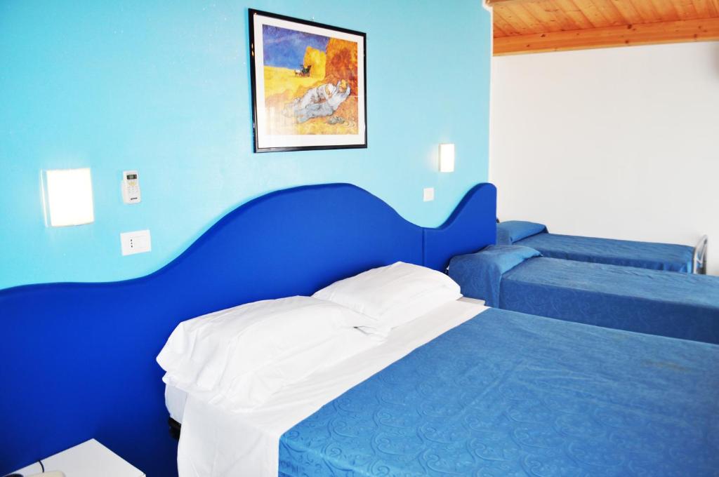 Postel nebo postele na pokoji v ubytování Hotel Albatros