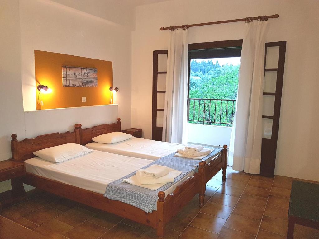 A bed or beds in a room at Alexandros Studios