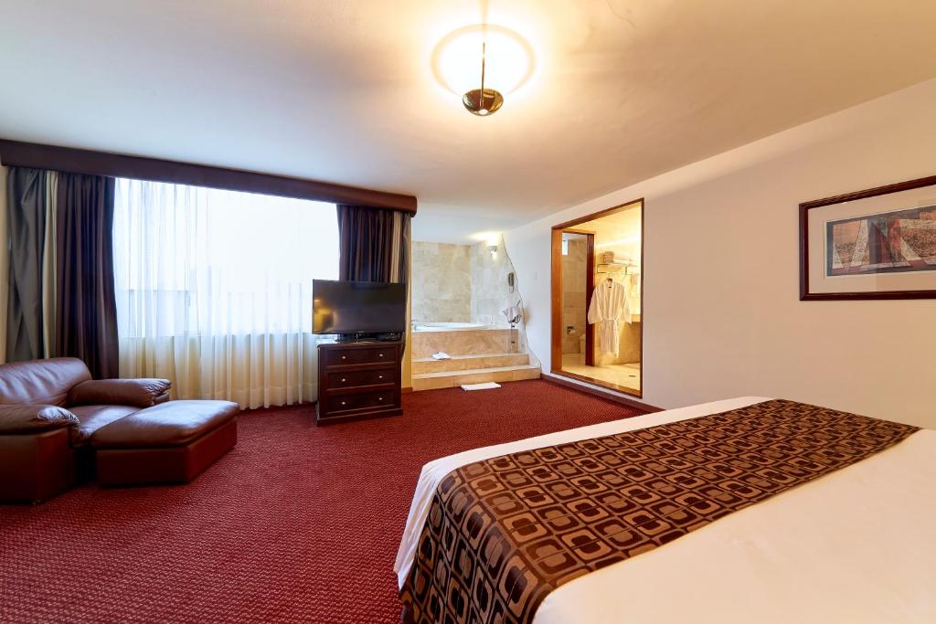 Ένα ή περισσότερα κρεβάτια σε δωμάτιο στο Hotel Carrera